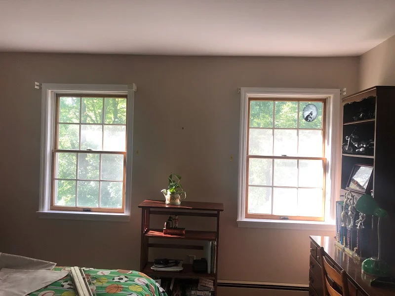 Double double hung windows with an unfinished pine interior in Cortlandt Manor, NY